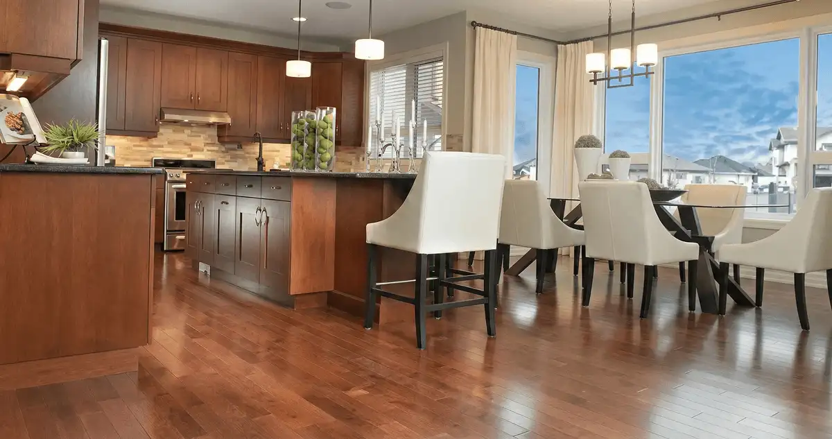 A modern kitchen with professionally installed wood flooring in Birmingham, AL