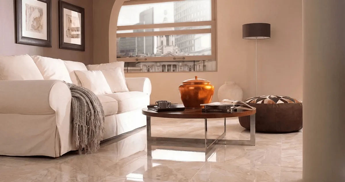 Modern living room with professionally installed marble flooring, a beige sofa, coffee table in Birmingham, AL