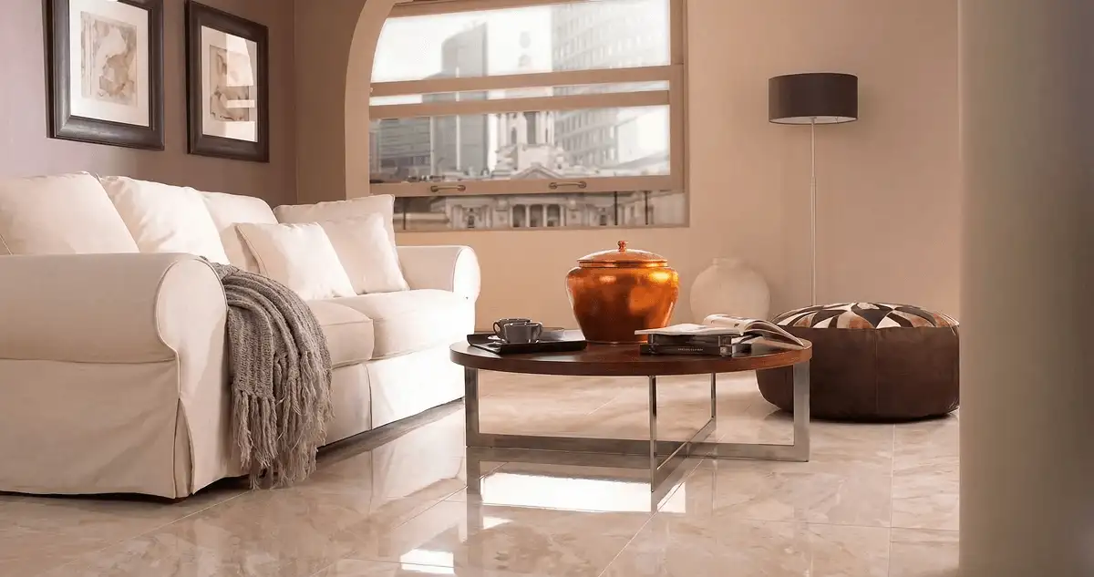 Modern living room with professionally installed marble flooring, a beige sofa, coffee table in Birmingham, AL