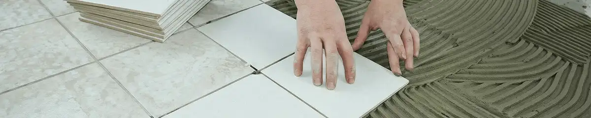 Professional installing white tile floors in Birmingham, AL